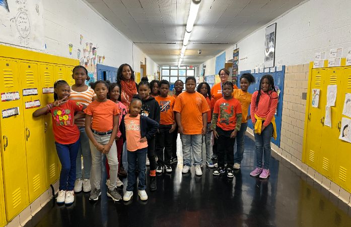  Class of students wearing orange for UNITY DAY.